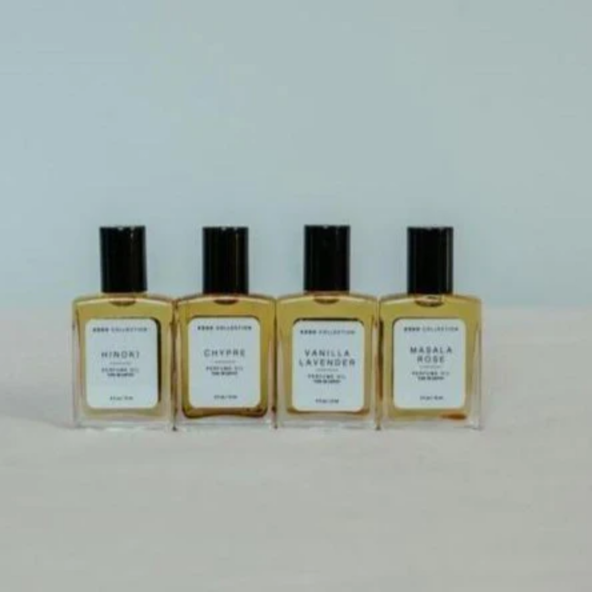 Fragrances | Elizabeth Homestead (Four bottles of wonderful scents lined up on a cream colored table)